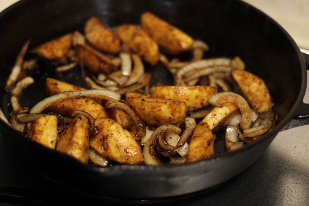 caramel apples and onions in cast iron skillet