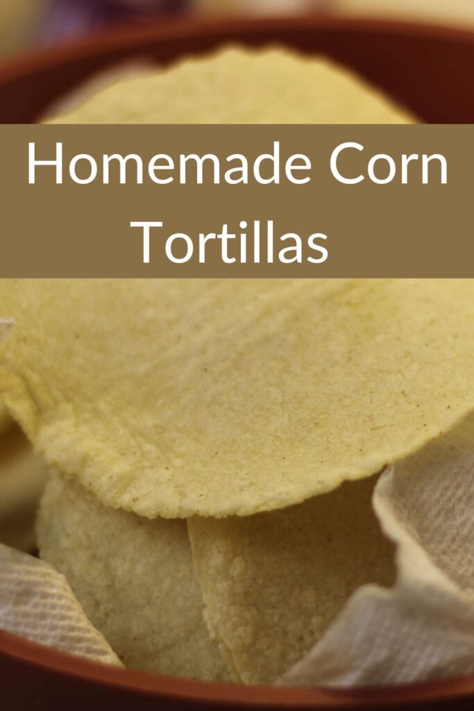 close up of homemade corn tortillas in tortilla warmer