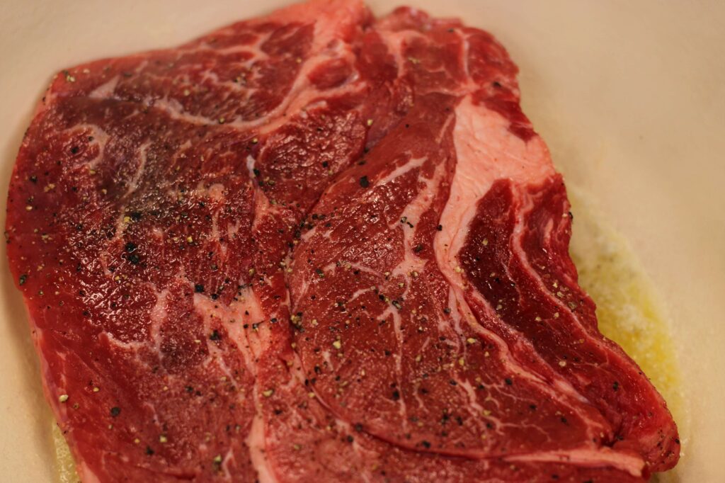 process shot of chuck roast in dutch oven 