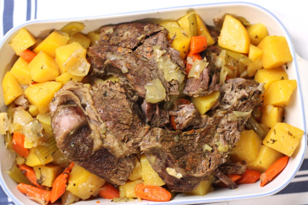 cooked pot roast with potatoes and carrots