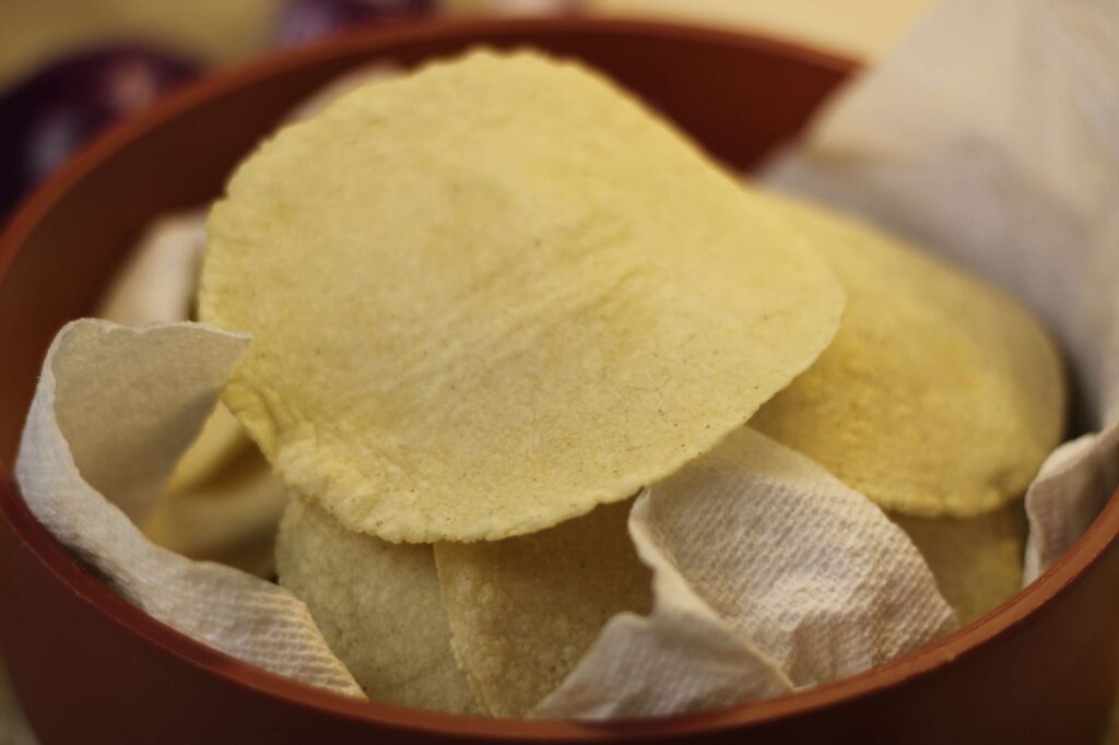 freshly made corn tortillas in tortilla warmer