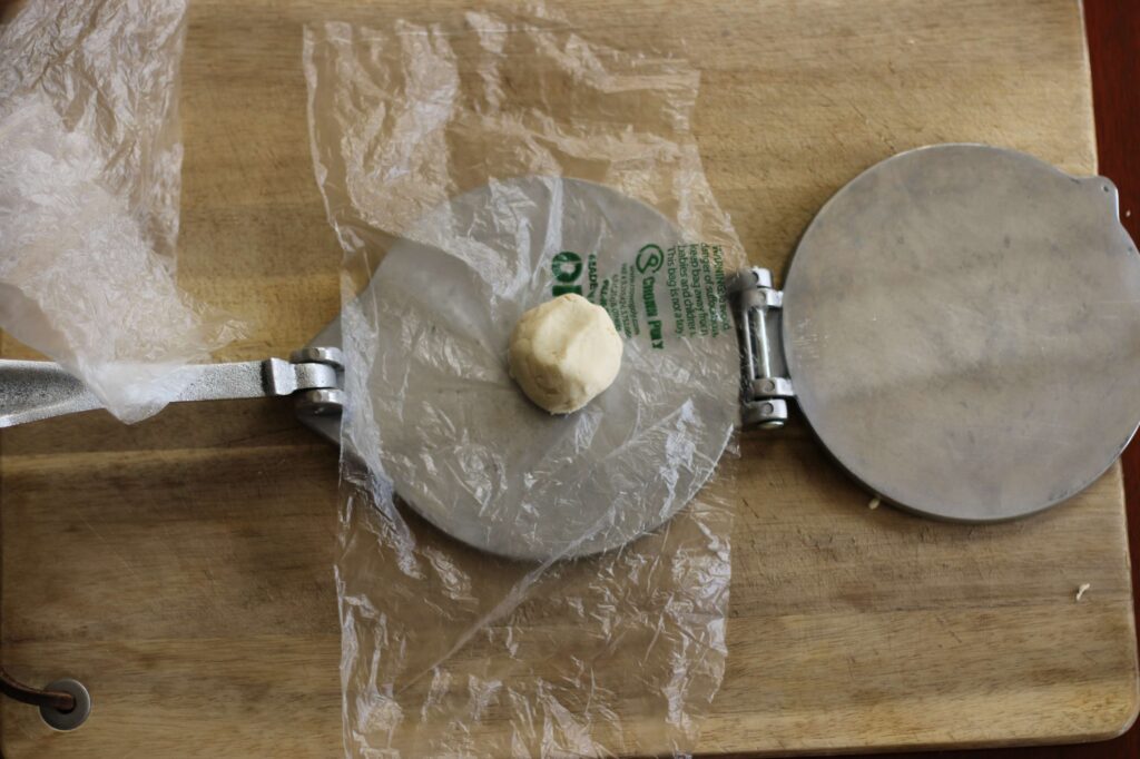 tortilla press in mid use