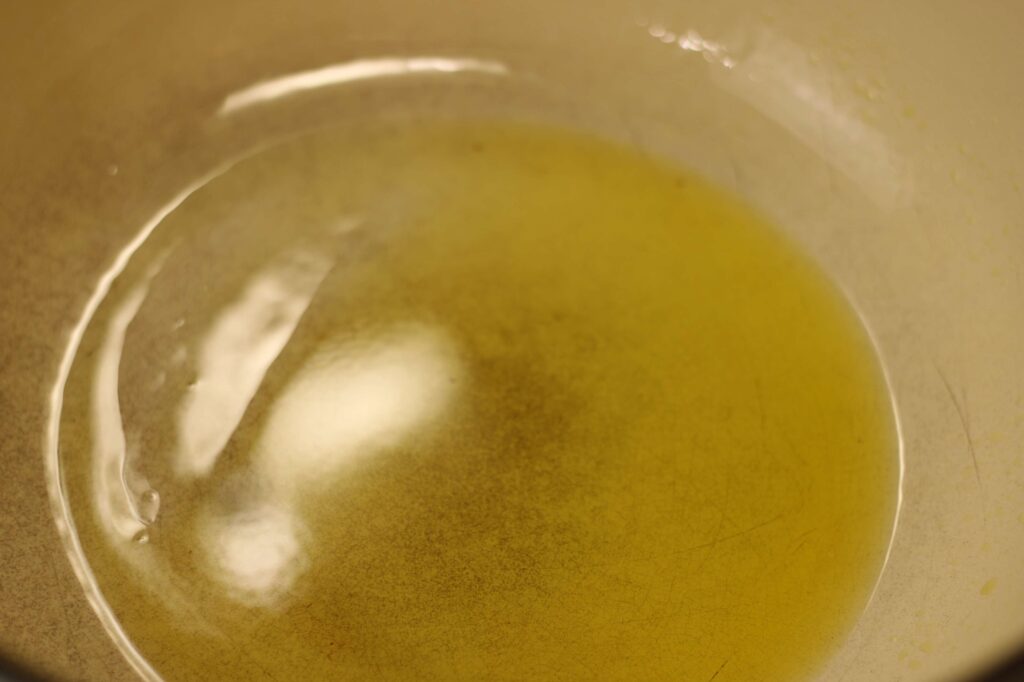 close up of olive oil on pot 