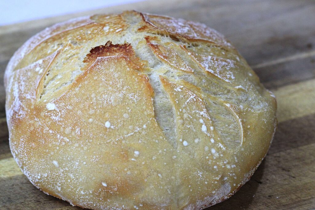 Artisan sourdough boule on a cutting board