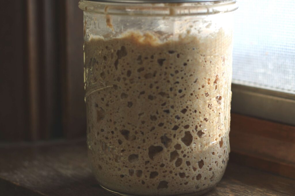  Bubbly sourdough starter in a mason jar