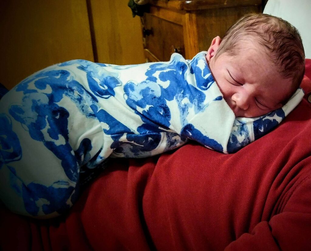 newborn resting on dad's chest