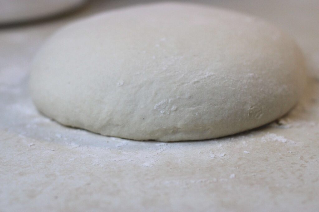 sourdough bagel dough on the counter after overnight rise 