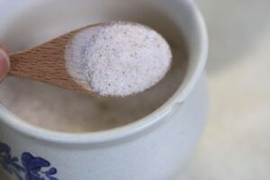 real salt in a wooden teaspoon
