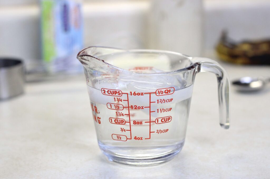 measuring cup of iced water