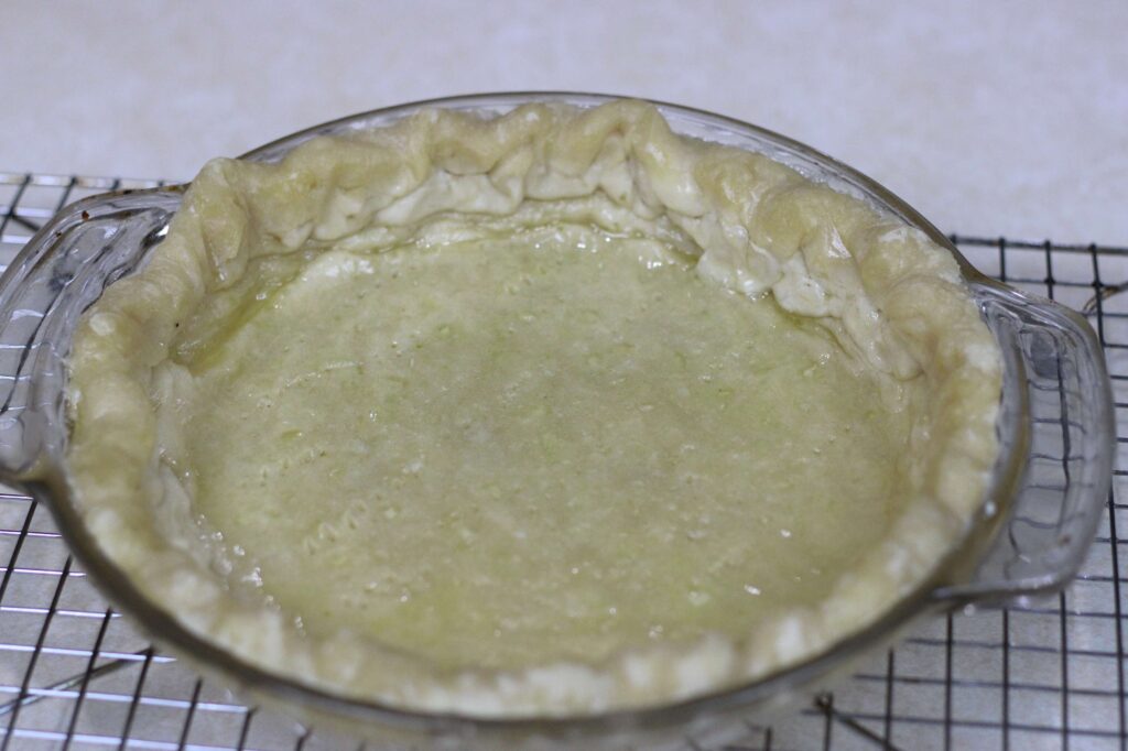 All-butter pie crust on glass pie dish