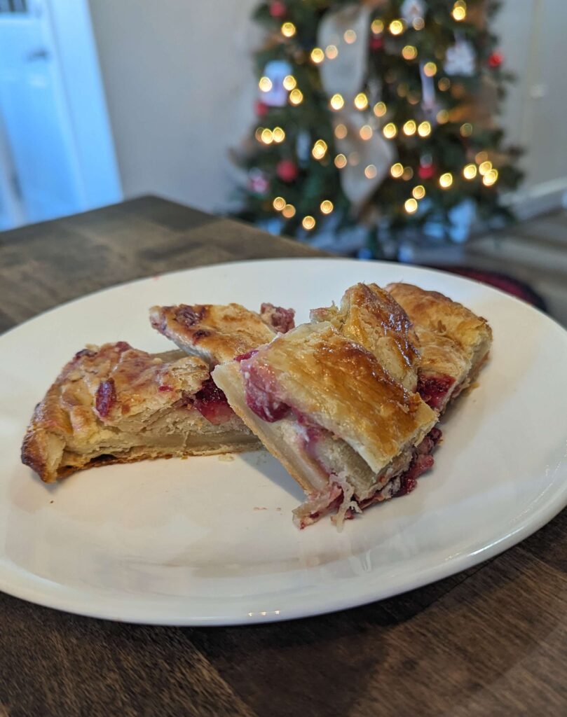 sourdough cranberry cream cheese danish on white plate 