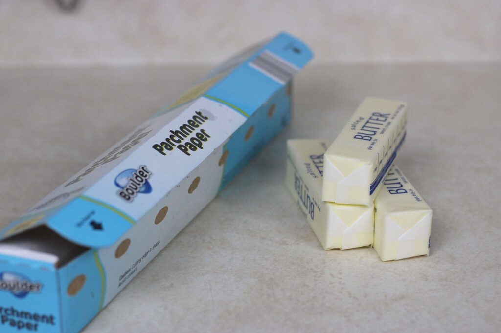 three sticks of butter and parchment for dough lamination