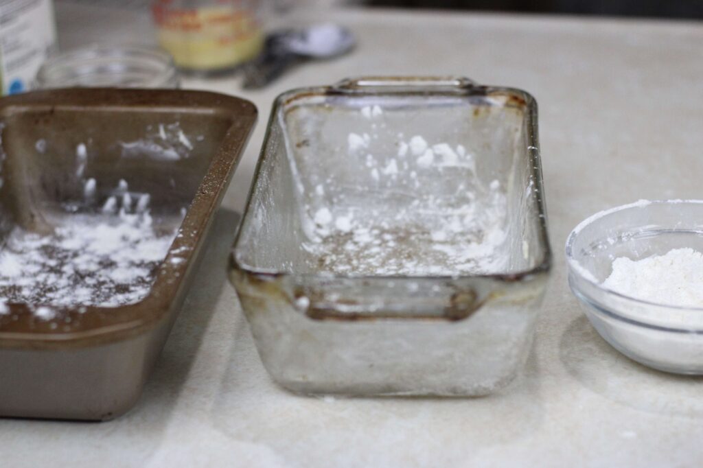 prepared bread pans sprinkled with flour