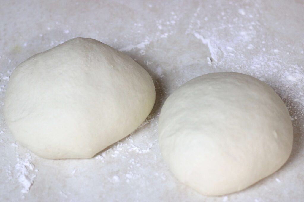 sourdough pizza dough balls on counter