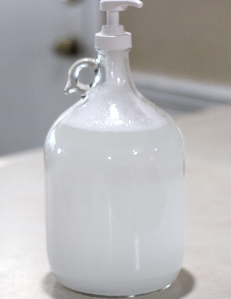 natural laundry detergent in gallon glass bottle with pump lid