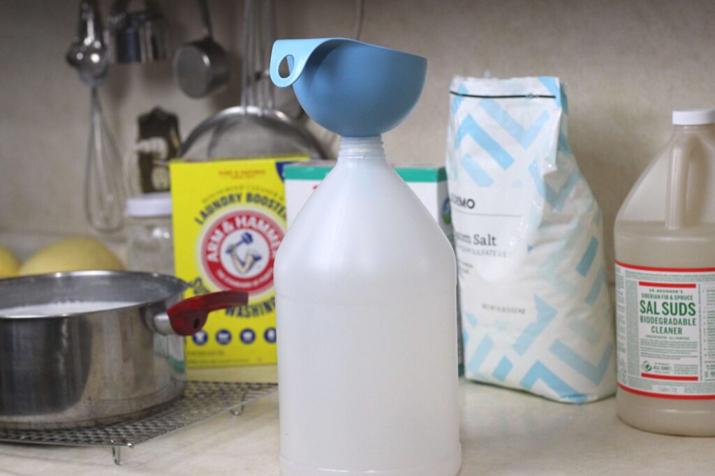 recycled one gallon bottle and funnel to store natural laundry detergent