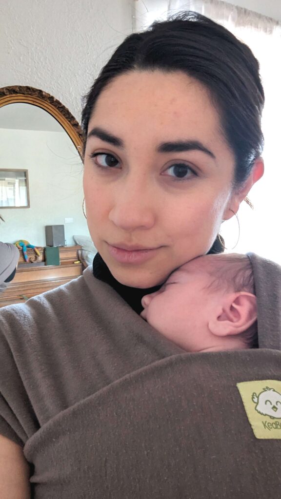 woman with newborn in wrap