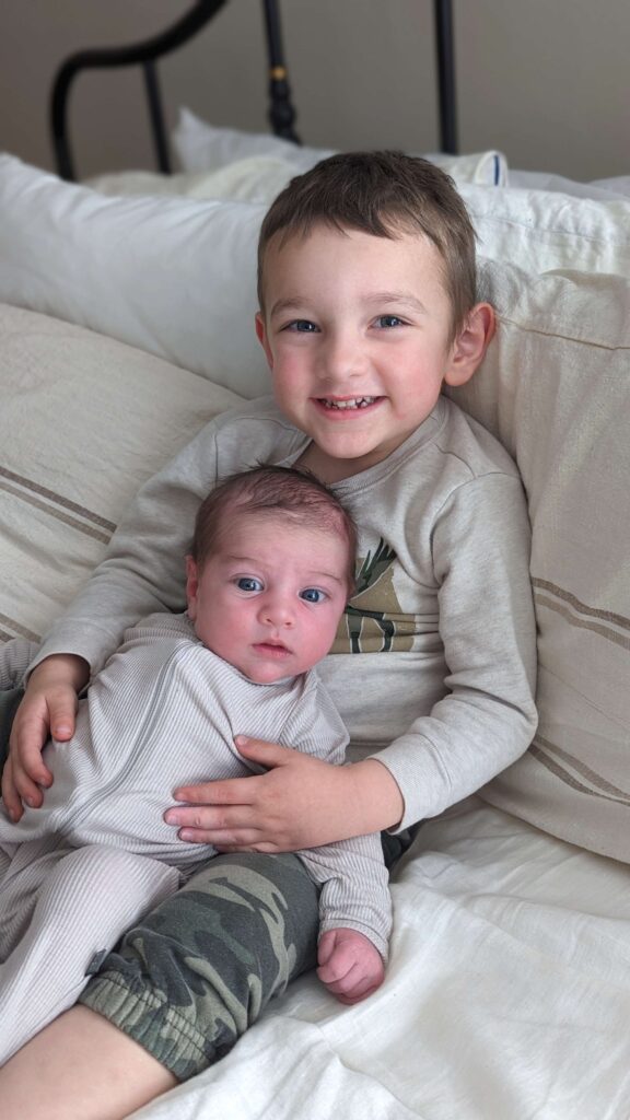 picture of little boy holding baby