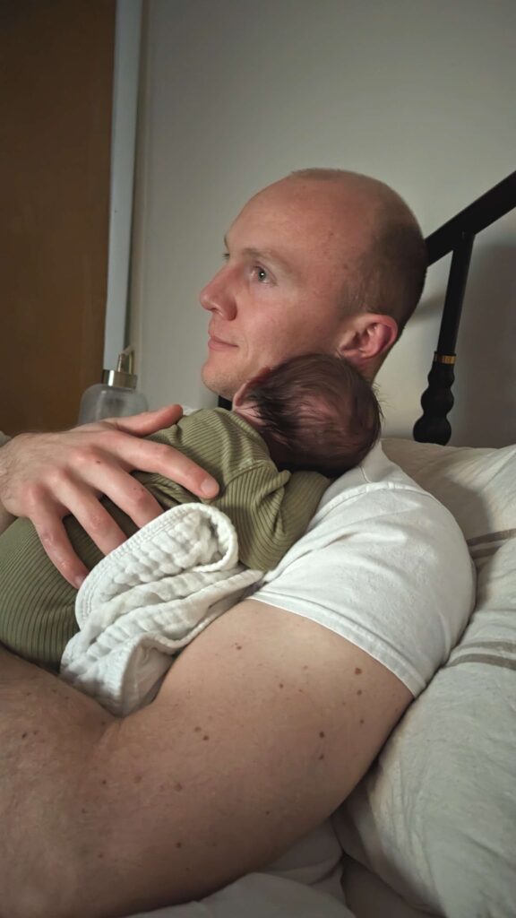 dad holding a newborn first 24 hours postpartum