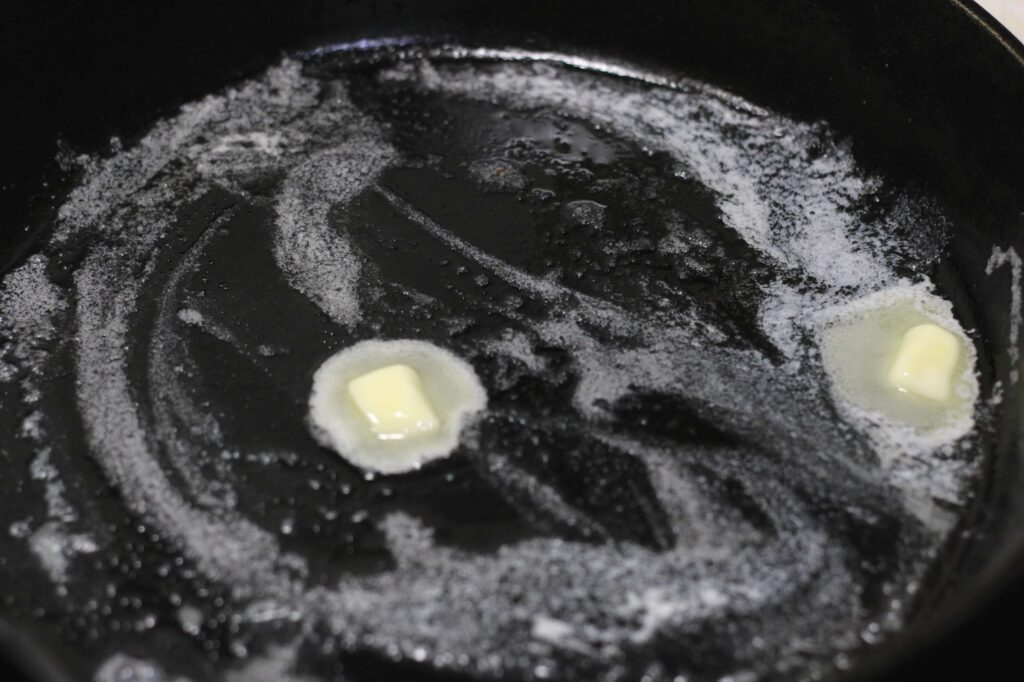 butter melting in cast iron skillet 