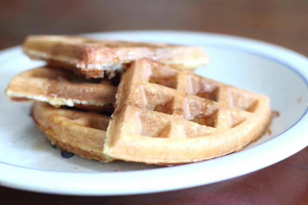 sourdough discard waffles cut up on a plate