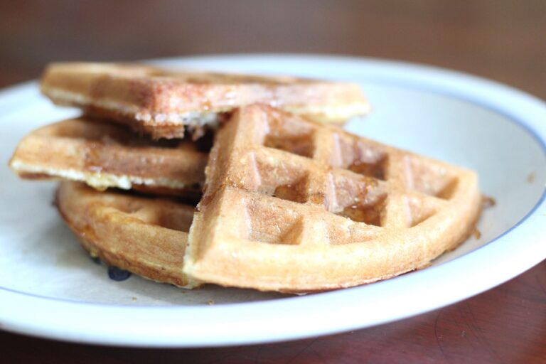 sourdough discard waffles cut up on a plate