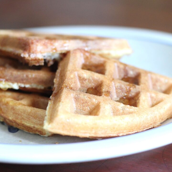 sourdough discard waffles cut up on a plate