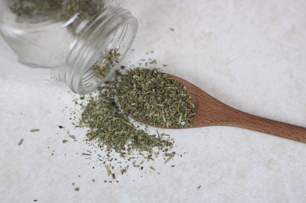 wooden teaspoon of Italian herbs