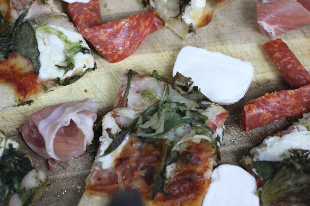 close up of flat bread pizza and toppings 