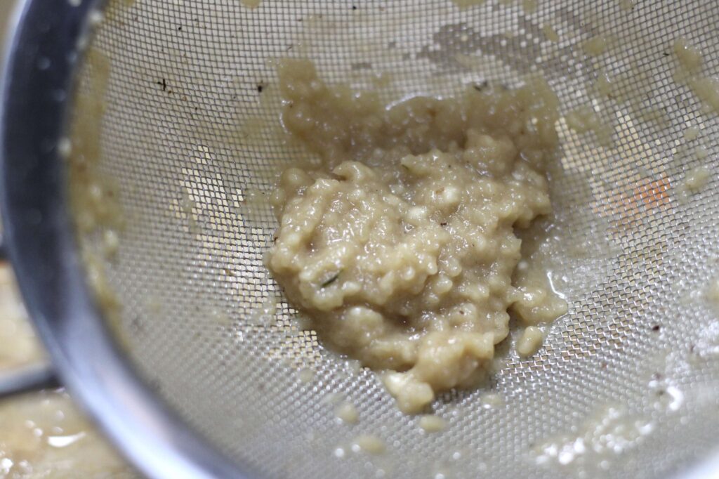 strained flour from sauce using the sifter method