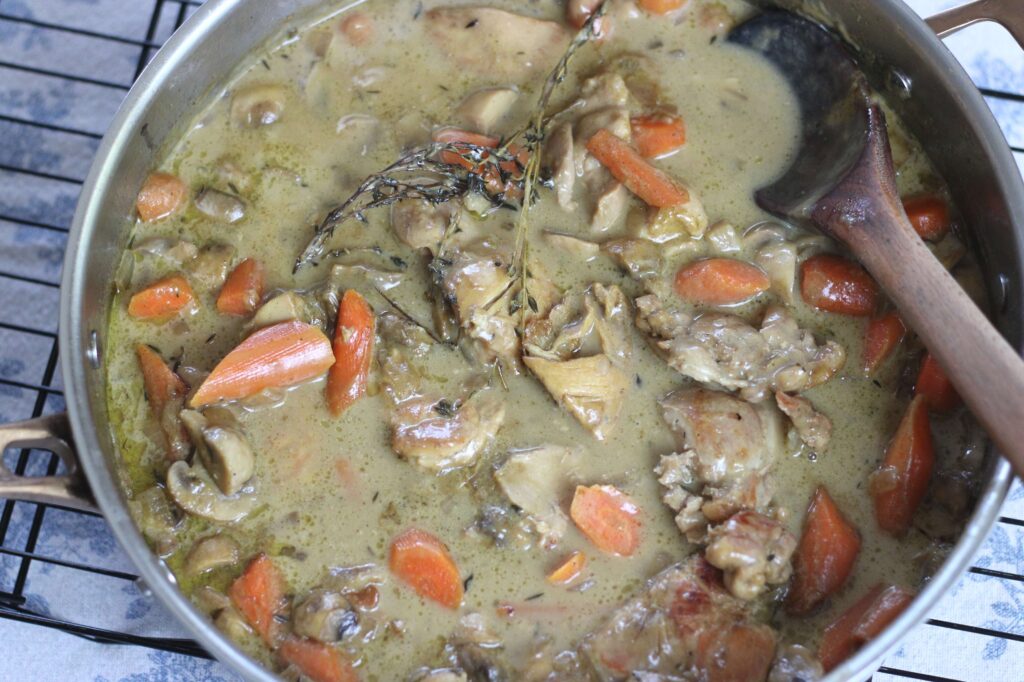 one-pot chicken fricassee stew with carrots mushrooms and onions