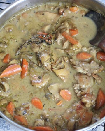chicken fricasse in stainless steel skillet