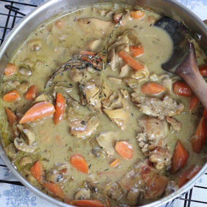 chicken fricasse in stainless steel skillet