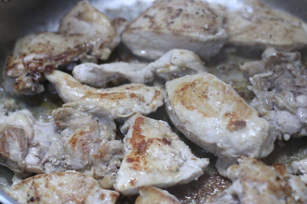 chicken browning in saucepan