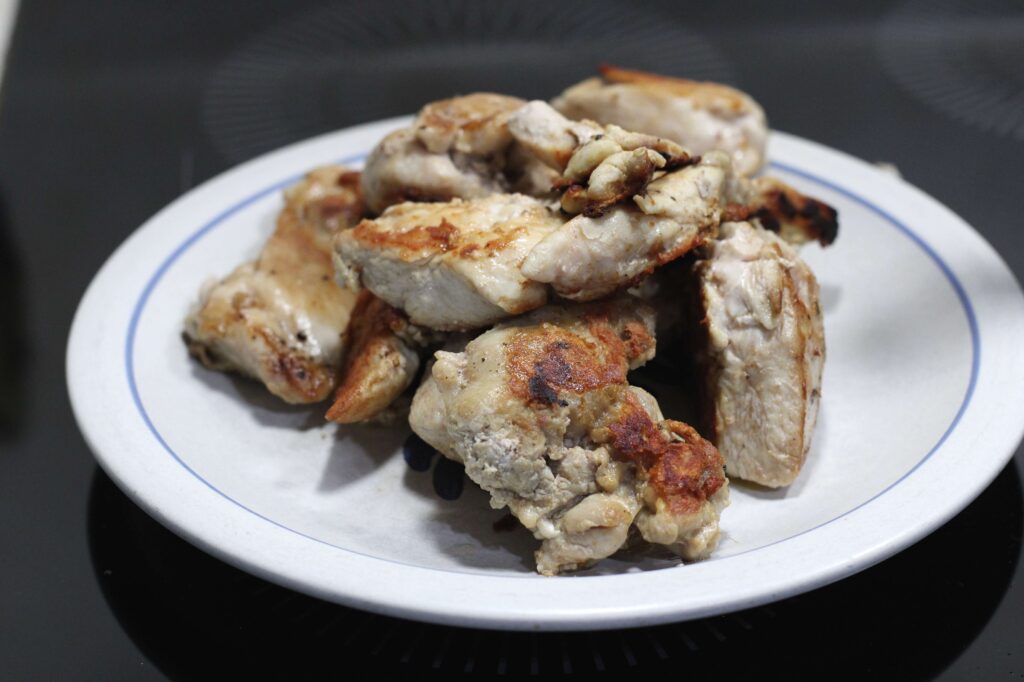 browned chicken pieces in a plate