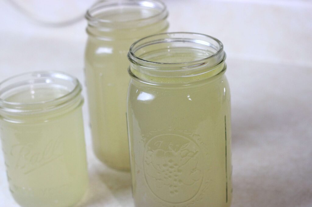 Homemade chicken broth in jars