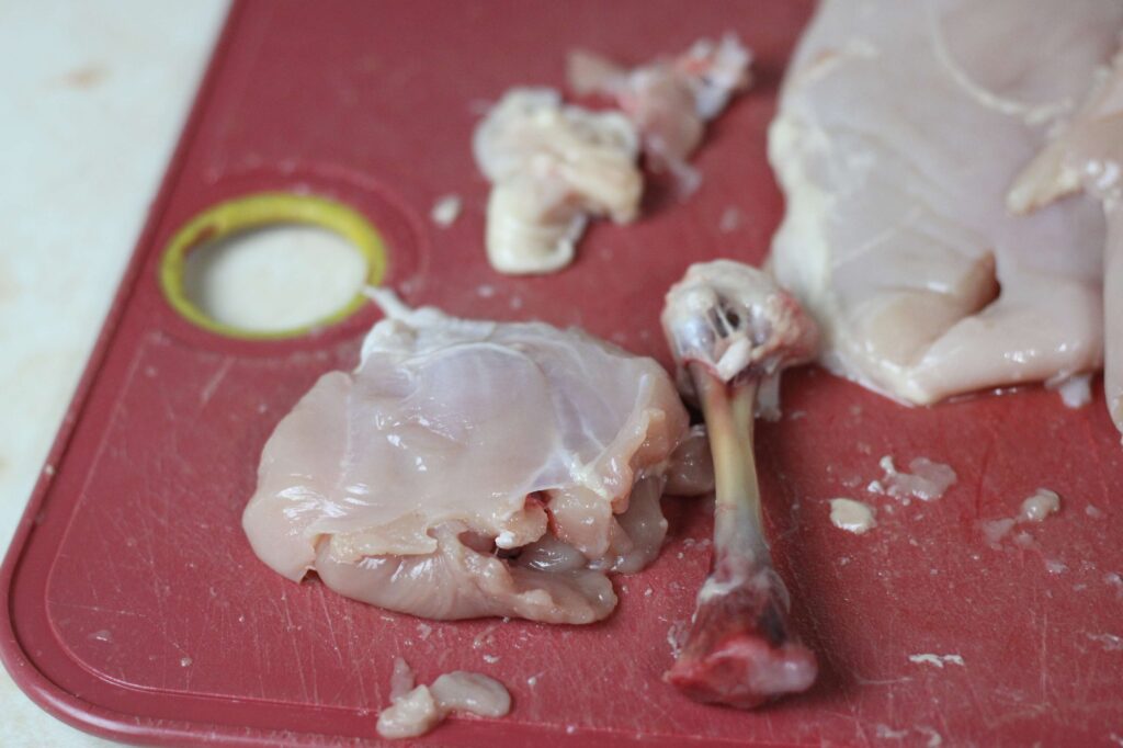 completely deboned chicken leg meat and bone 