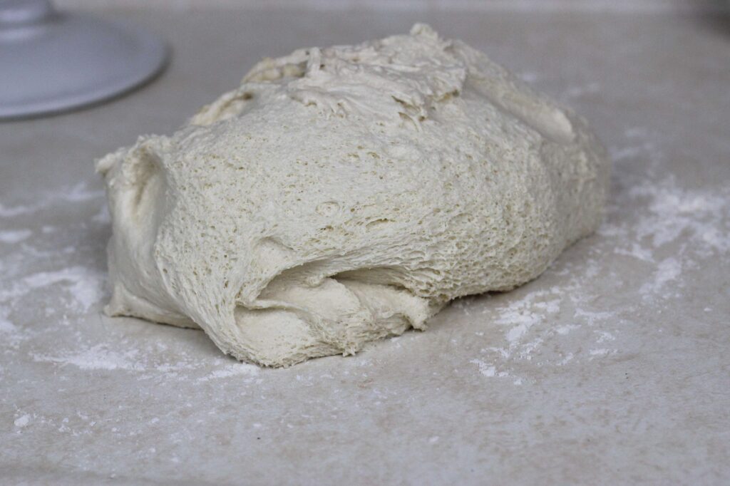 sourdough cinnamon roll dough on the counter 