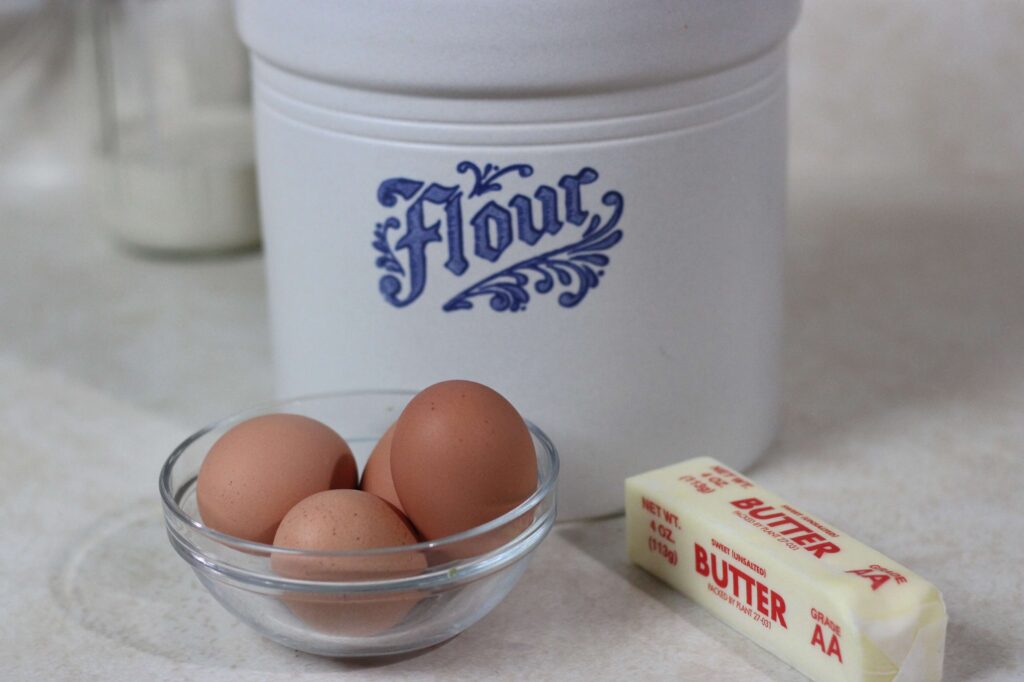 flour canister, brown eggs, and butter 
